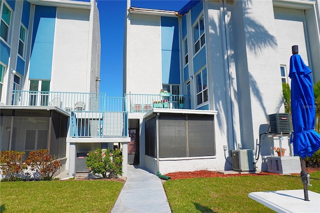 view of building exterior featuring central air condition unit