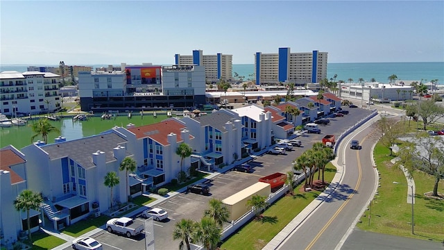 birds eye view of property with a water view