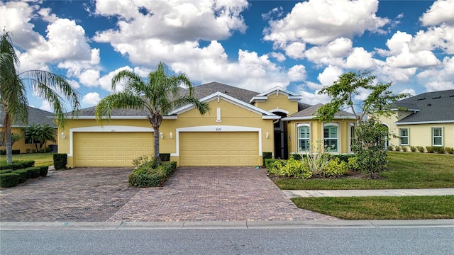 single story home with a garage