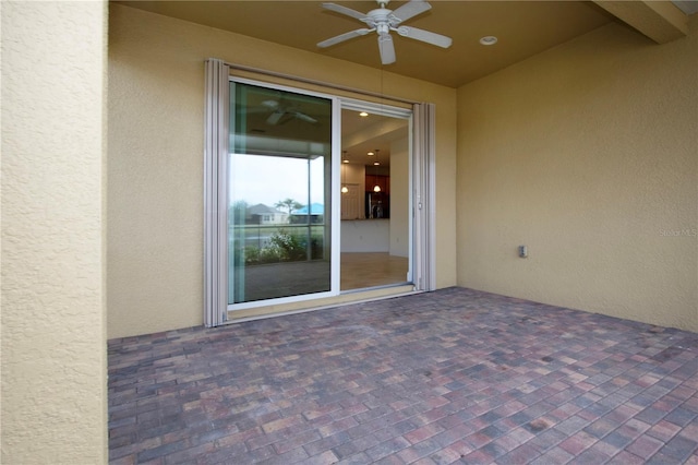 view of patio featuring ceiling fan