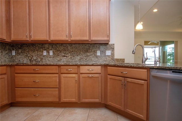 kitchen featuring sink, tasteful backsplash, light tile patterned floors, dishwasher, and light stone countertops