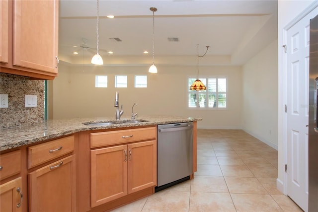 kitchen featuring decorative light fixtures, tasteful backsplash, dishwasher, sink, and a raised ceiling