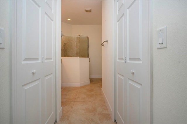 bathroom featuring tile patterned floors and a shower