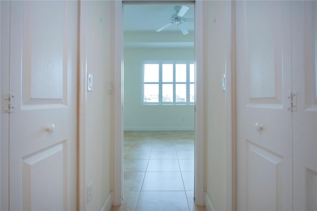 corridor featuring light tile patterned flooring