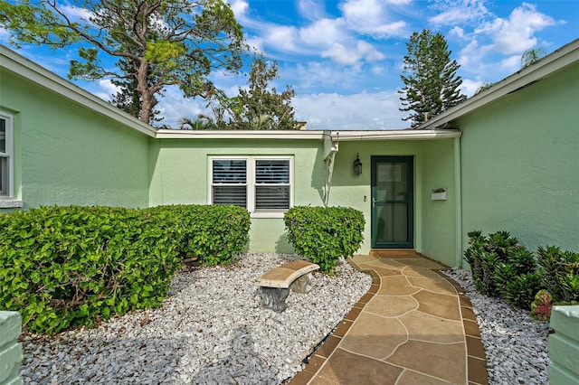 property entrance with a patio area