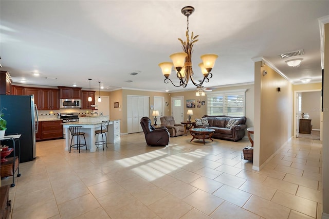 3887 50th Ave S, Saint Petersburg, FL 33711 - living area featuring crown molding, light tile patterned floors, a chandelier, and baseboards