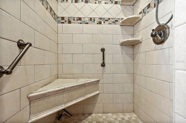 bathroom with a tile shower