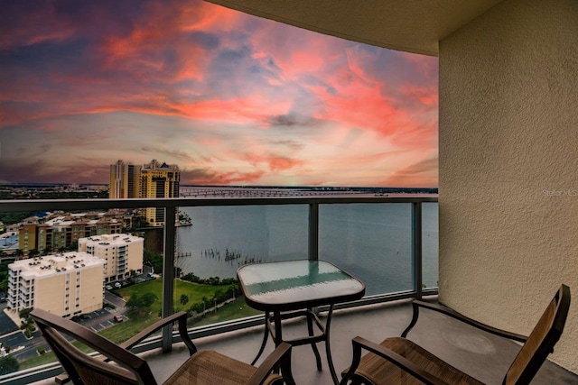 balcony at dusk with a water view