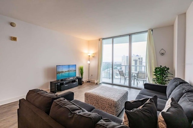 living room featuring expansive windows and wood-type flooring