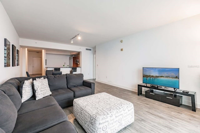 living room with wood-type flooring