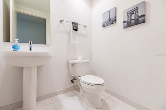 bathroom featuring tile patterned floors and toilet