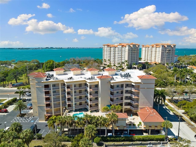 birds eye view of property with a water view