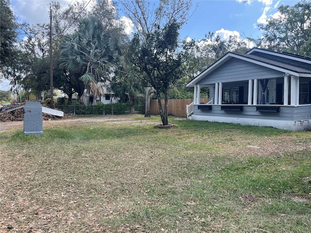 view of yard featuring a sunroom