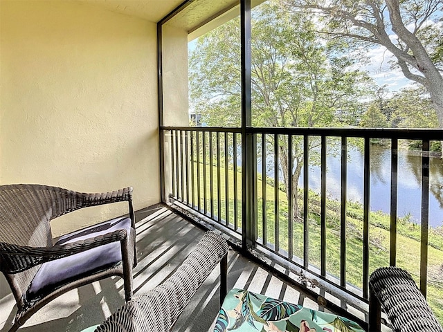 balcony featuring a water view