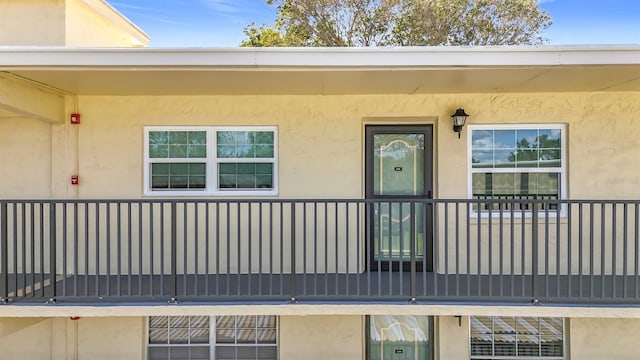 entrance to property with a balcony