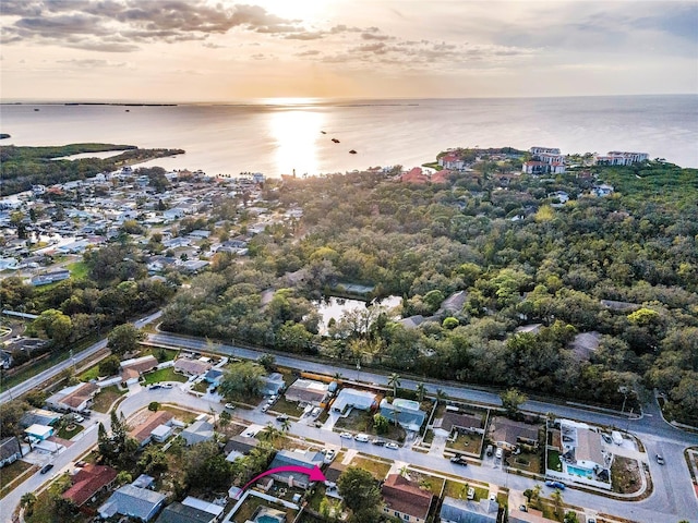 aerial view at dusk with a water view