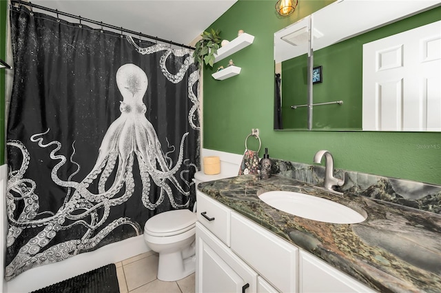 bathroom featuring tile patterned floors, toilet, and vanity