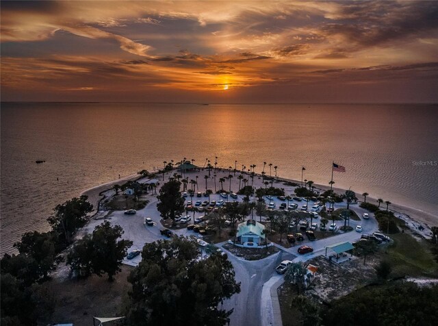 aerial view at dusk with a water view