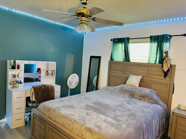 bedroom with light wood-type flooring and ceiling fan