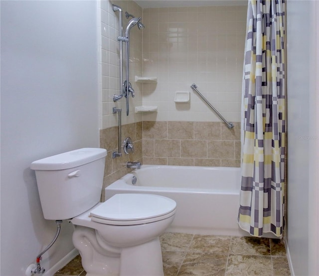 bathroom with shower / bath combination with curtain and toilet