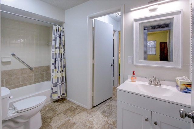 full bathroom featuring shower / bath combination with curtain, toilet, and vanity