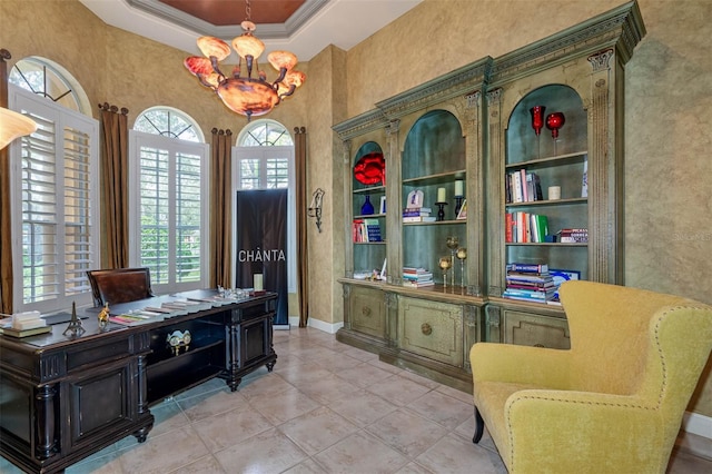 tiled office with a notable chandelier, ornamental molding, and a raised ceiling