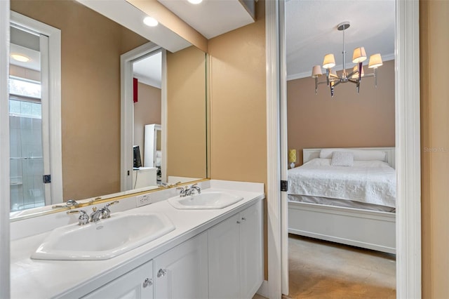 bathroom featuring vanity, crown molding, and a chandelier