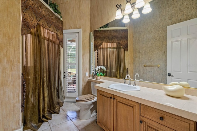 bathroom featuring vanity, toilet, and tile patterned floors