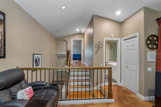 corridor with lofted ceiling