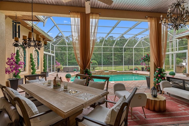 view of patio featuring glass enclosure