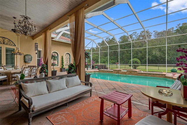 view of pool featuring an outdoor living space, a patio, and a lanai