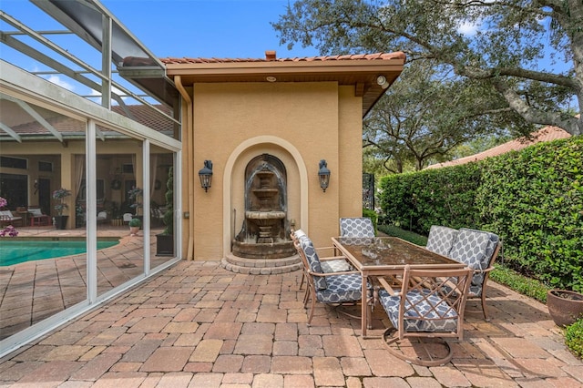 view of patio / terrace with a lanai and a fenced in pool