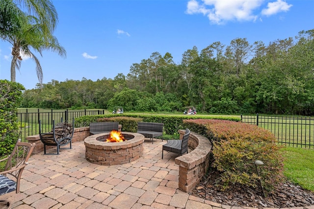 view of patio / terrace featuring an outdoor fire pit