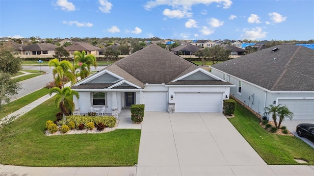 view of front of property with a front yard and a garage