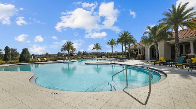 view of swimming pool featuring a patio area