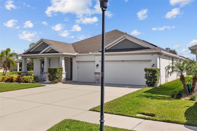 view of front facade with a front lawn and a garage