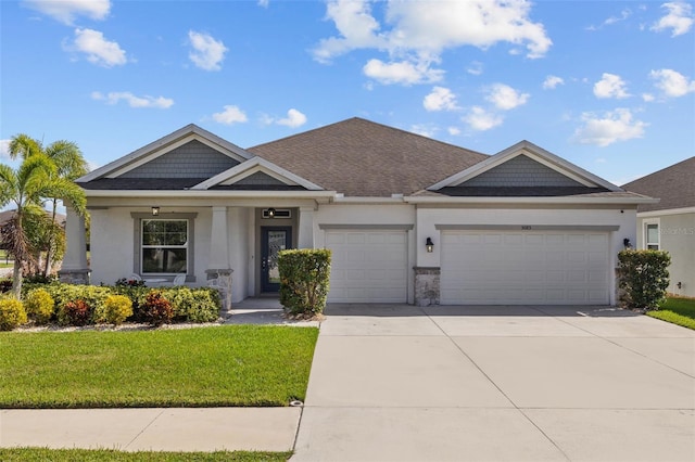 view of front facade with a front yard and a garage