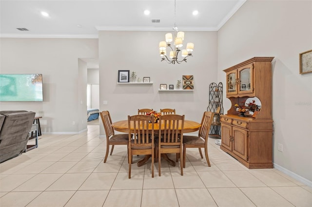 dining space featuring light tile patterned flooring, ornamental molding, and a chandelier