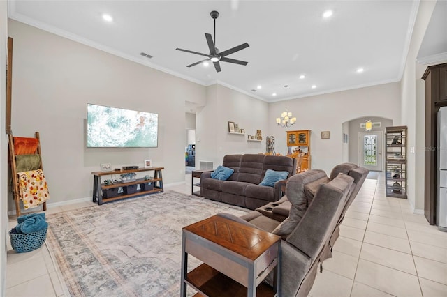 tiled living room featuring ornamental molding and ceiling fan with notable chandelier