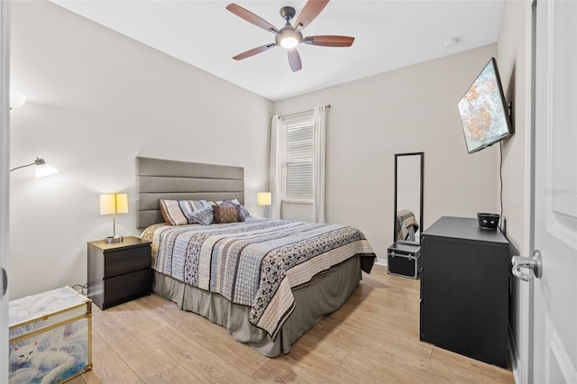 bedroom featuring light wood-type flooring and ceiling fan