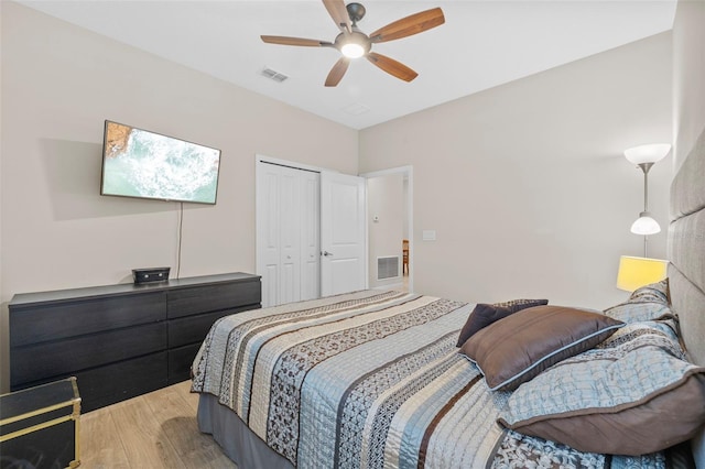 bedroom featuring a closet, ceiling fan, and light hardwood / wood-style flooring