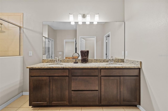 bathroom with vanity, tile patterned floors, and a shower with door