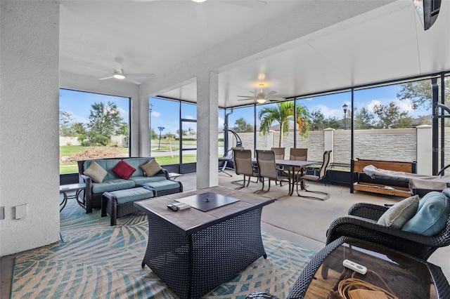 sunroom with ceiling fan