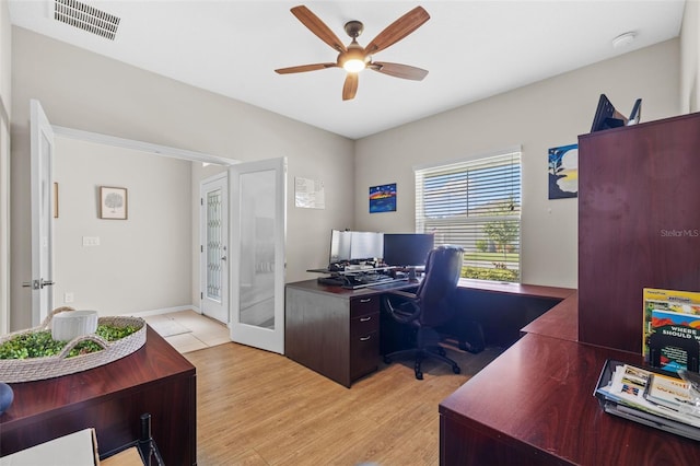 office featuring ceiling fan and light hardwood / wood-style flooring