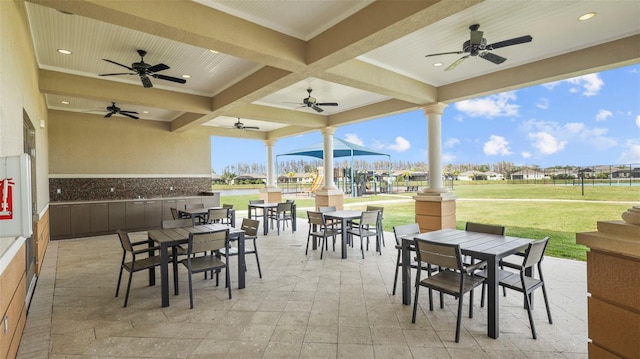 view of patio featuring ceiling fan