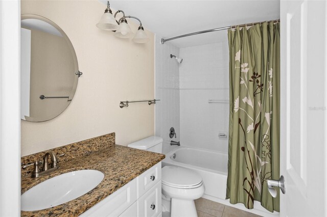 full bathroom featuring vanity, toilet, tile patterned flooring, and shower / tub combo