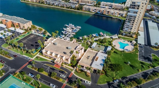 birds eye view of property with a water view