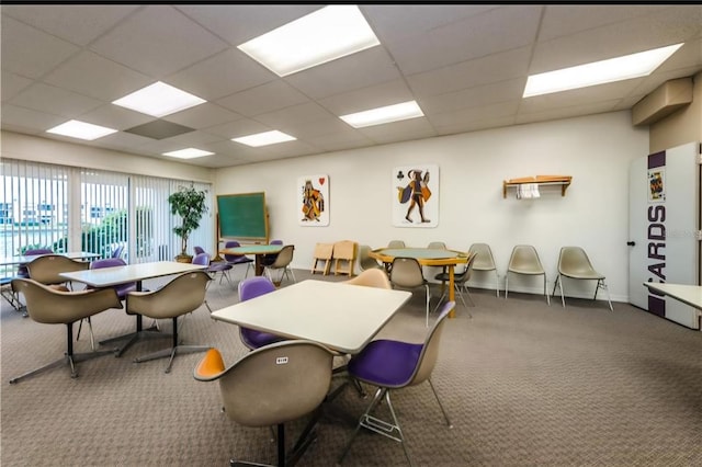 7625 Sun Island Dr S Unit 101, South Pasadena, FL 33707 - dining area with carpet floors, a drop ceiling, and baseboards