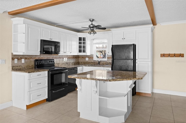 7625 Sun Island Dr S Unit 101, South Pasadena, FL 33707 - kitchen featuring black appliances, open shelves, tasteful backsplash, white cabinetry, and a textured ceiling