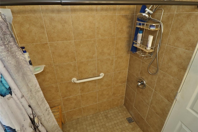 bathroom with a shower with shower curtain